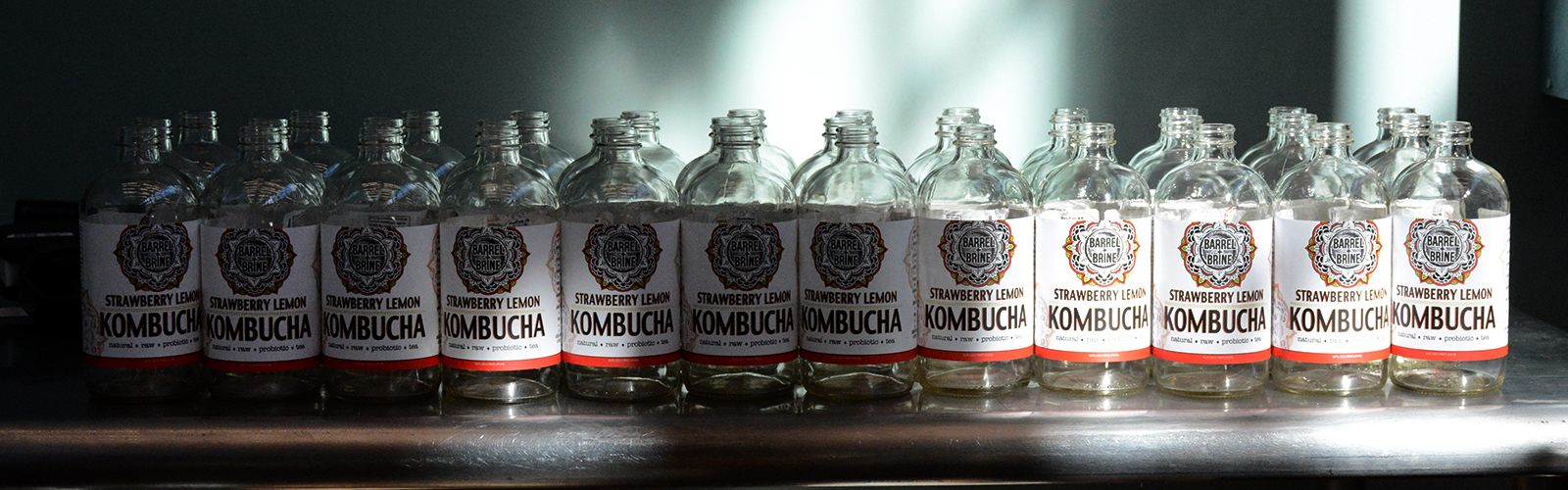 Bottles waiting to be filled with strawberry lemon kombucha at Barrel + Brine, 155 Chandler St., Suite # 3, Buffalo, N.Y.