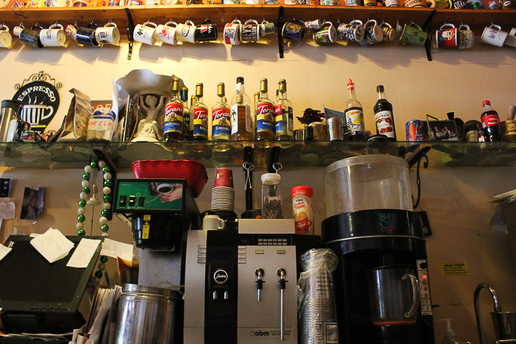 The coffee-making magic happens behind the counter.