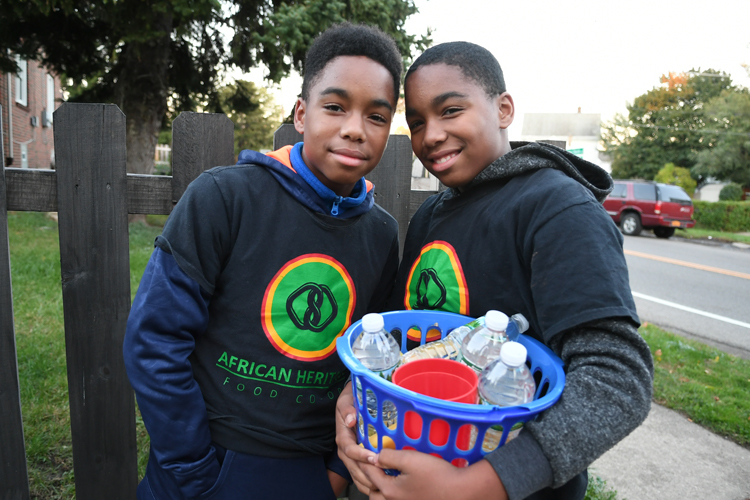 The Wright Twins – Rashid and Rashad – ready to sell fruits and water during a Slow Roll break