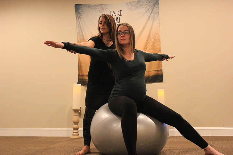  Yoga Instructor Molly McDermott and a client, Emily More in the Warrior 2 pose.