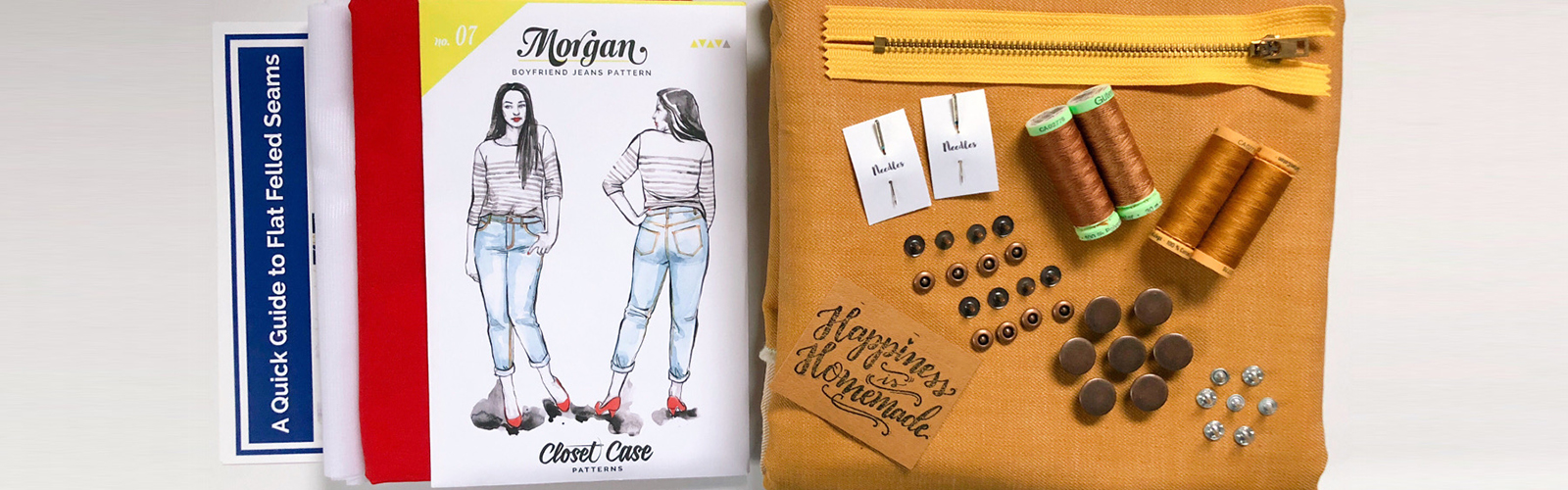 Needle Sharp subscription kits come with everything needed to complete a sewing project, including pattern, fabric, thread, needles, and buttons.