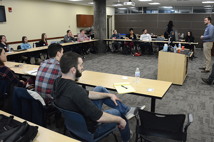 WNY Prosperity Fellowship alum Aaron Krolikowski leads a discussion at a recent alumni event. 