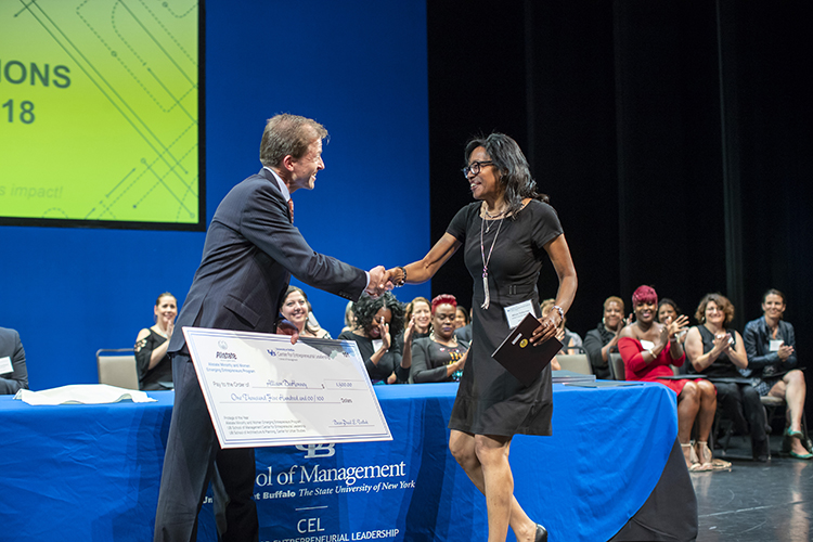 Allstate MWEE program’s Protégé of the Year, Allison DeHonney, accepts the award from Paul Tesluk, dean of the UB School of Management.