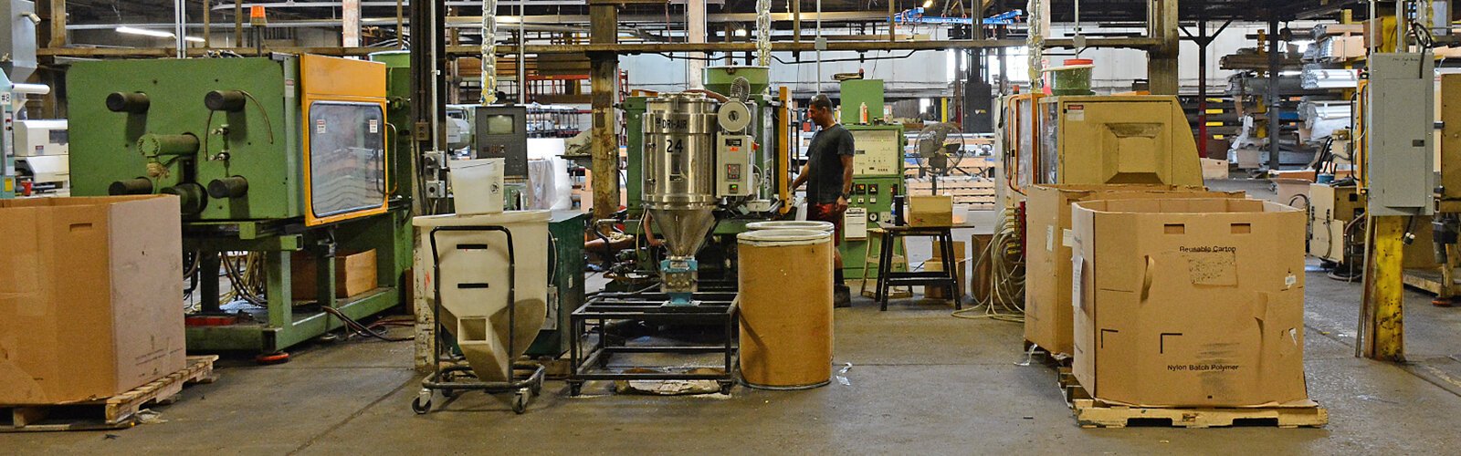 A bank of injection molding machines at Avanti Advanced Manufacturing, located on Ontario Street in Buffalo’s Riverside area.