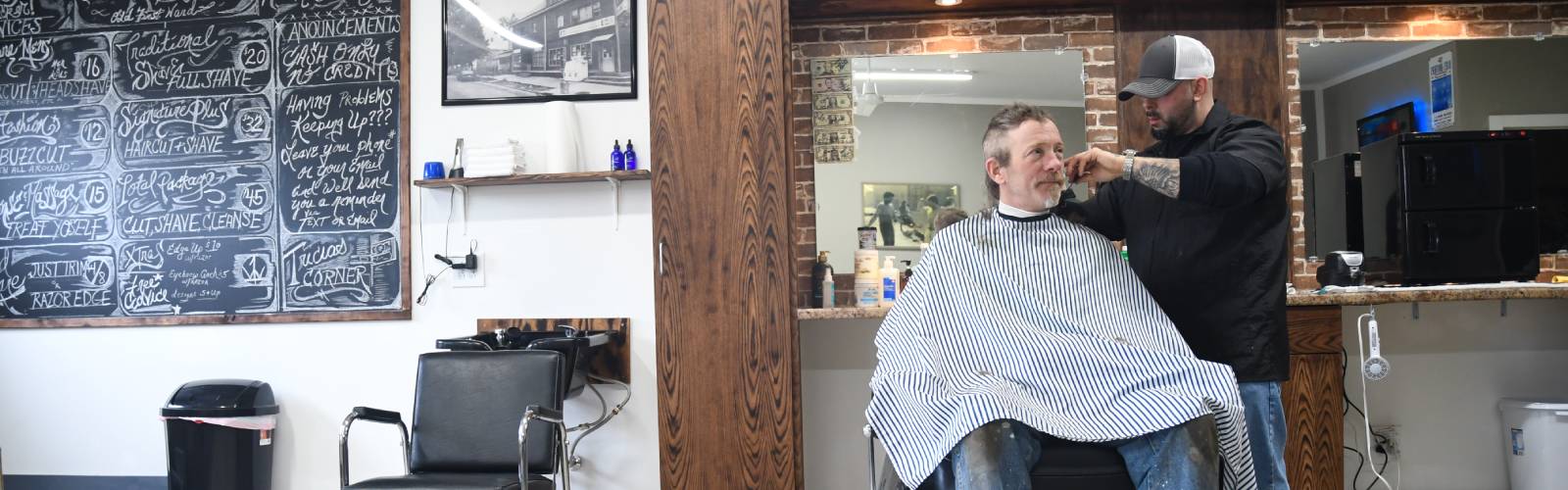 Rock Boyz Barbershop is full of neighborhood history, including old street signs and photographs from the Old First Ward.