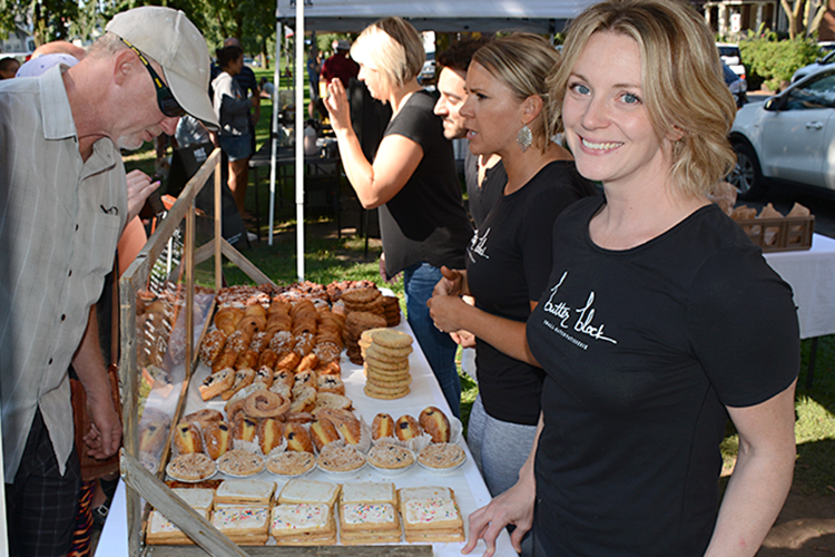 Butter Block owner Colleen Stillwell stands at her tent at the Elmwood/Bidwell Farmers Market. 