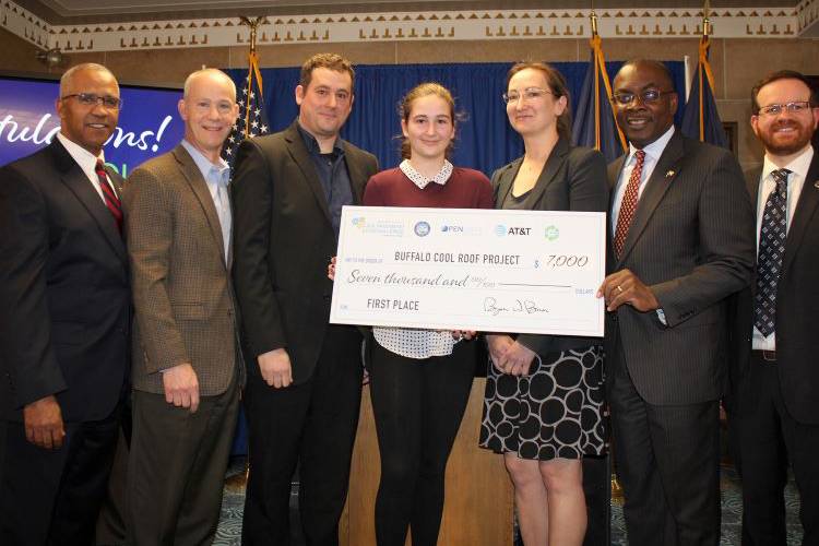 Civic Innovation Eco Challenge first-place winners Agnes Wilewicz and Jesse Farinacci with Mayor Byron Brown and judges.