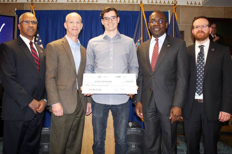 Civic Innovation Eco Challenge second-place winner Jonathan Hutchison with Mayor Byron Brown and judges.