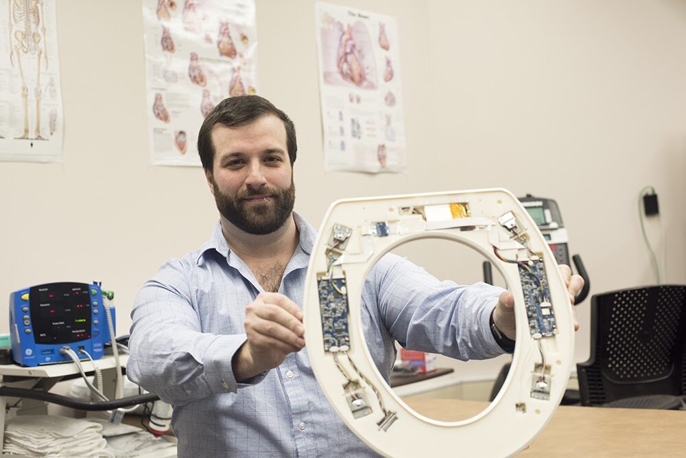 Nicholas Conn, CEO of Heart Health Intelligence, with his invention, the Heart Seat.