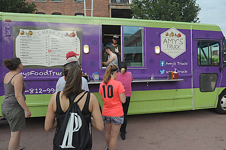 Foodies line up for Amy’s Truck’s Lentil-Berry and Margie and Biff sandwiches. Their primarily veggie choices keep health options on the table.