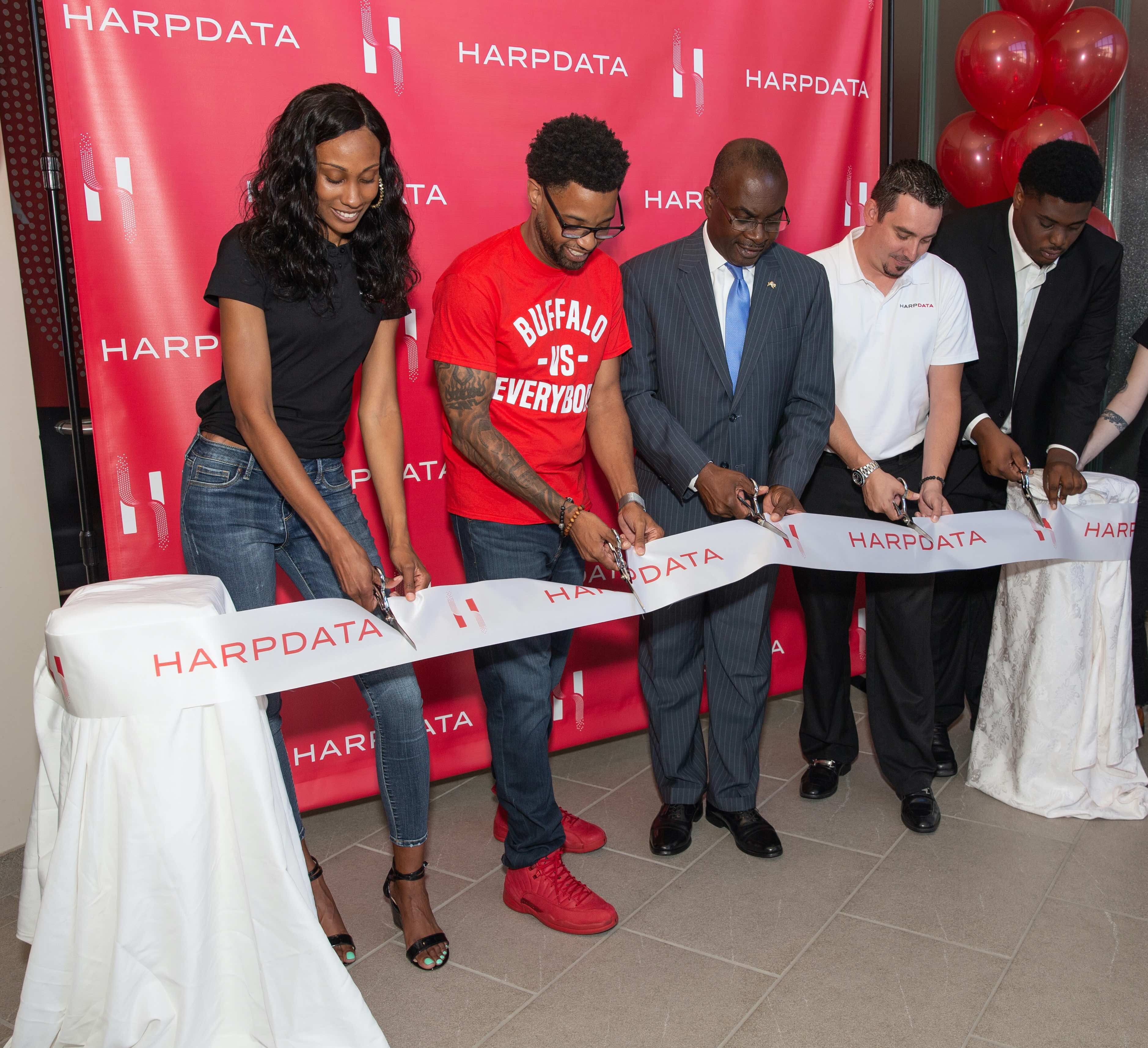 HarpData CEO and founder Ivory Robinson cuts the ribbon with Buffalo Mayor Byron Brown.