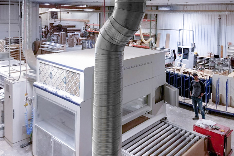 Erran Fichman in his company’s 10,000 square foot factory in Holland, N.Y. The machine in the foreground is part of the company's automated manufacturing platform.