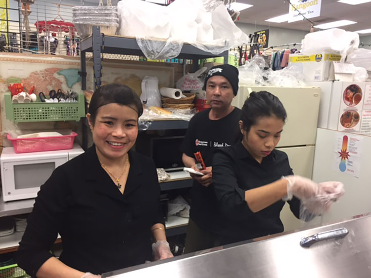 Wa Wa Khiang (L) and her daughter Su Way (R)  prepare food.