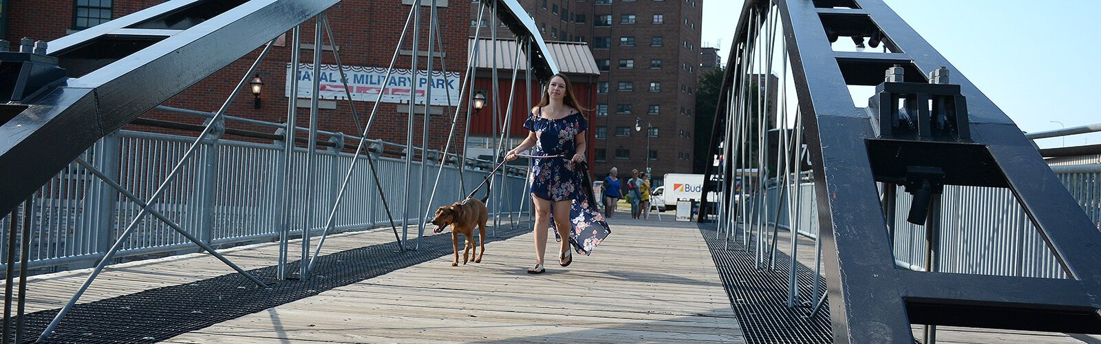 Kimberly LaRussa, the founder of Sweet Buffalo, walks her one-year-old coonhound, Belle, across the historic Canal Terminus Bridge. LaRussa’s daily blog has touched many visitors from Western New York and beyond.