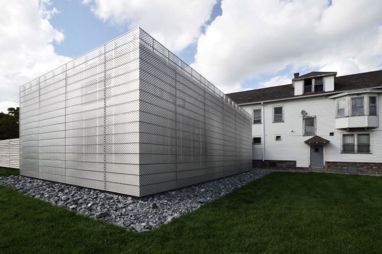 Torn Space Theater’s newly built extension is a stainless-steel sculpture that houses a design studio and conference space. 