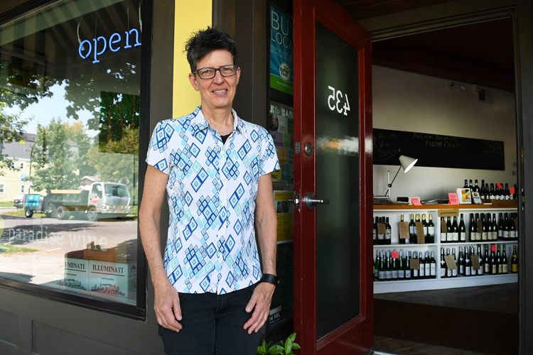 Paula Paradise, co-owner of Paradise Wine, in front of the west side business.