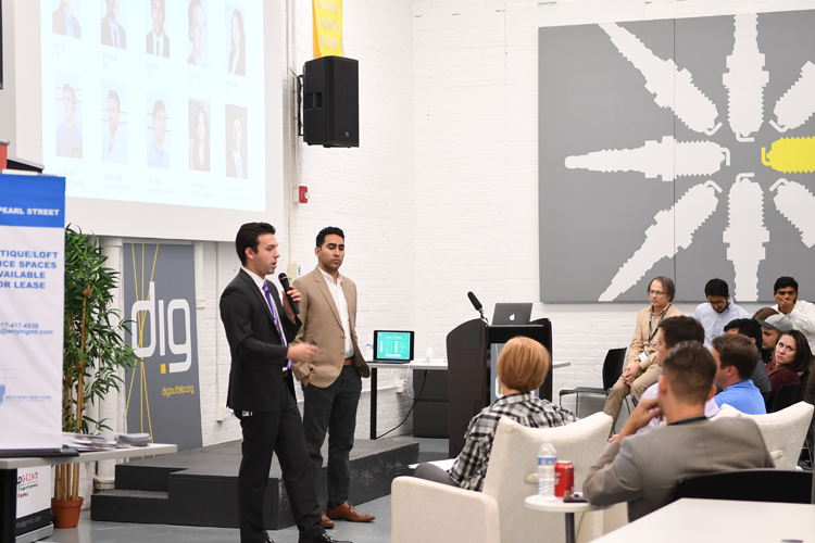 Richard Izzo, and Rohin Sethi of Eye for an Eye, mid-pitch at Startup Weekend Buffalo