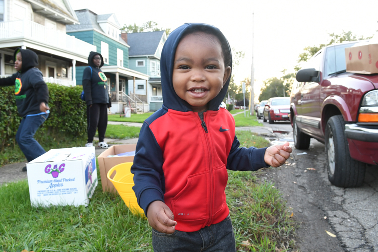 Baby James Wright, age 1.5, helps sell fruit during Slow Roll 