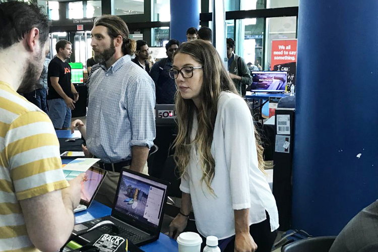 Kevin and Christian Cullen of Stand-Up Paddle Boards (SUP) Erie Adventures speak to guests at the University at Buffalo Entrepreneurs Festival Thursday, Sept. 14 at the UB Student Union.