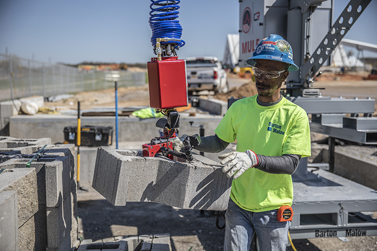 Construction Robotics’ Material Unit Lift Enhancer helps masons lift cinder blocks. 