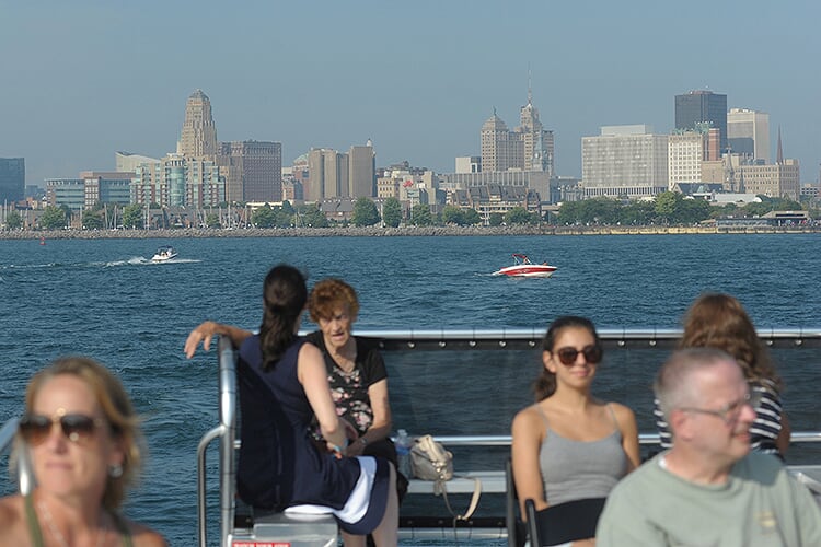 Buffalo River History Tours passengers, shown here on the open upper deck, enjoy a spectacular view of the Buffalo skyline.