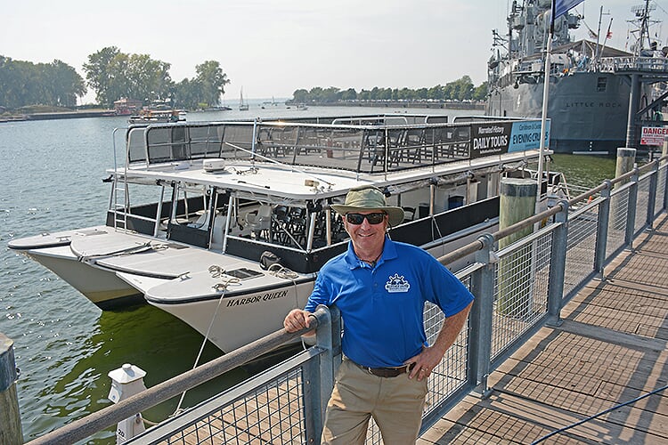Harbor Queen captain and owner Rich Hilliman stands at the Canalside dock where the tour of the Buffalo River begins. 