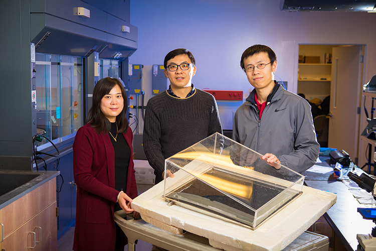 Sunny Clean Water co-founders Zongmin Bei, UB senior research support specialist in engineering, and Qiaoqiang Gan, UB associate professor of electrical engineering, with UB Ph.D. graduate Haomin Song, the company's chief technical officer.