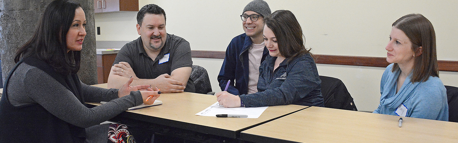 Hadar Borden with WNY Prosperity Fellowship program alumni Matt Coia, Phil Schneider, Celine Keefe, and Amy Monin. Fellows are given scholarships and internships to assist them in gaining experience in their intended professions.